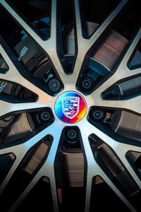 Porsche vehicle wrapped in vibrant General Formulations AutoMark™ DRIFT® Wrap Vinyl showcasing 75 years of Porsche craftsmanship